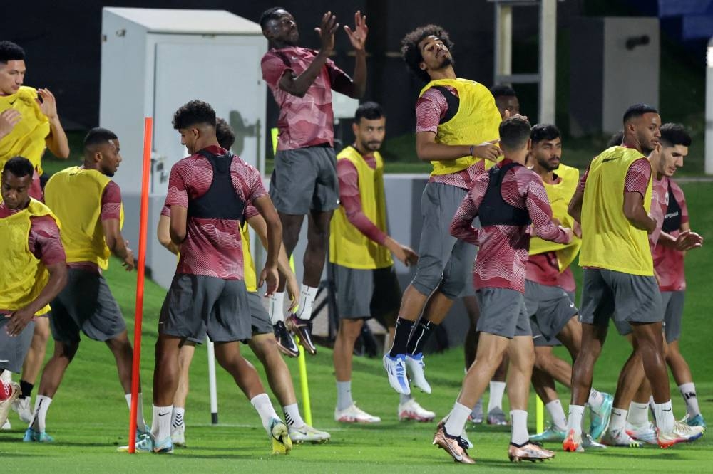 Qatar's players attend a training session in Doha on November 15, 2022, ahead of the Qatar 2022 World Cup football tournament. (Photo by KARIM JAAFAR / AFP)