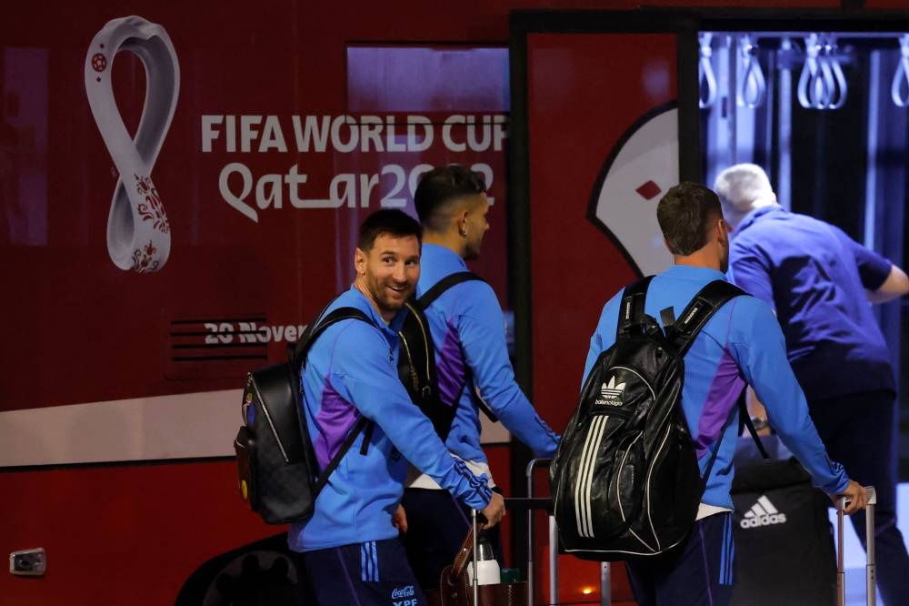 Argentina's forward Lionel Messi and teammates arrive at the Hamad International Airport. (Photo by Odd ANDERSEN / AFP)