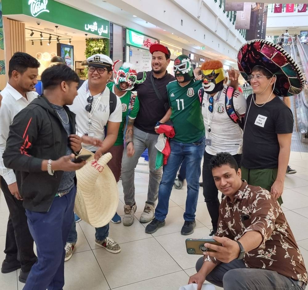 Mall-goers taking pictures with supporters.