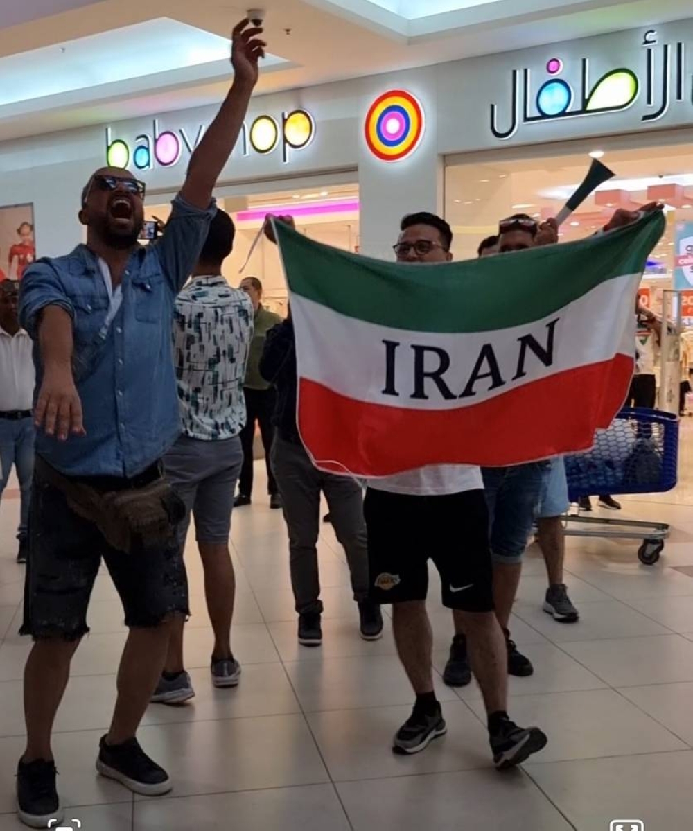 Fans cheer for their team.