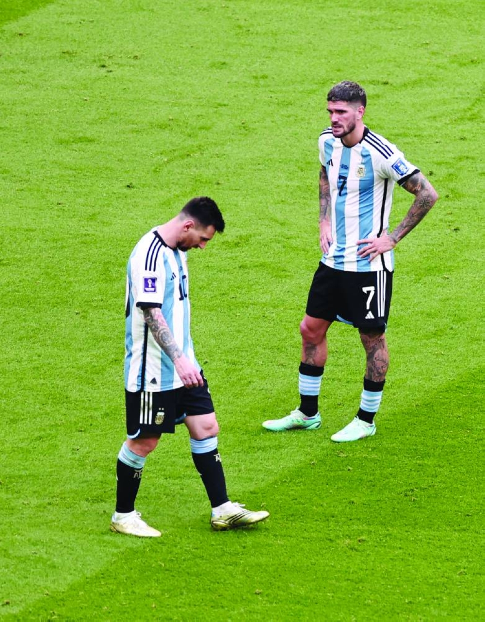 Argentina's Lionel Messi and Rodrigo De Paul dejected after the match. (REUTERS)