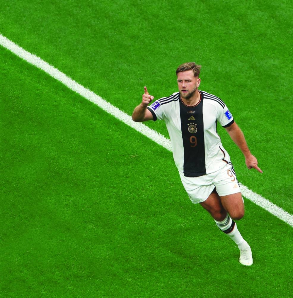 Germany's Niclas Fullkrug celebrates scoring their first goal against Spain at Al Bayt Stadium. (Reuters)