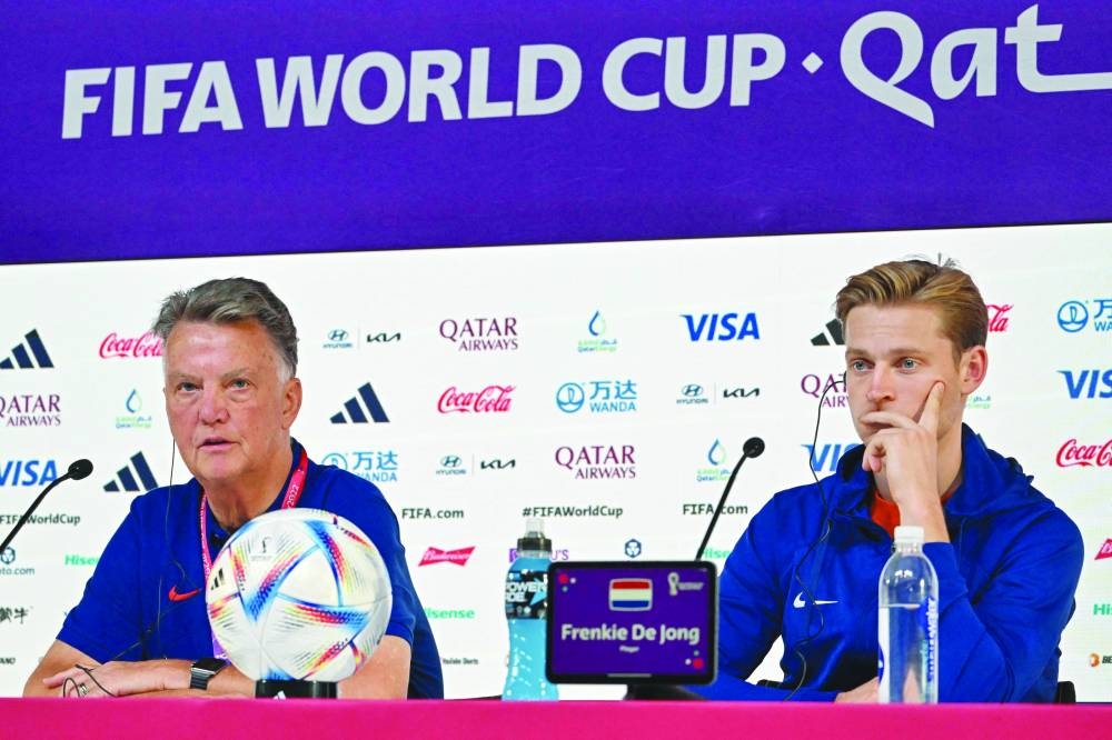 Netherlands' coach Louis Van Gaal (left) and Netherlands' midfielder Frenkie De Jong attend a press conference in Doha yesterday. Hosts Qatar take on the Netherlands today. (AFP)