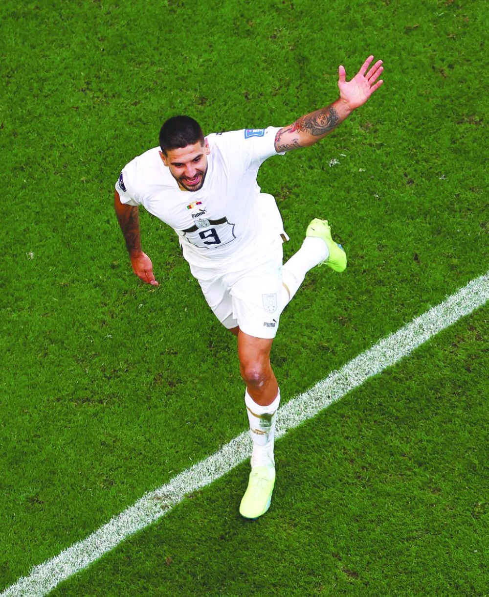 Serbia’s Aleksandar Mitrovic celebrates scoring their third goal against Cameroon yesterday. (Reuters)