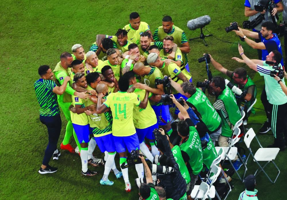 Brazil’s Casemiro celebrates with teammates after scoring against Switzerland during the FIFA World Cup Qatar 2022 Group G match at the Stadium 974 in Doha yesterday. (Reuters)