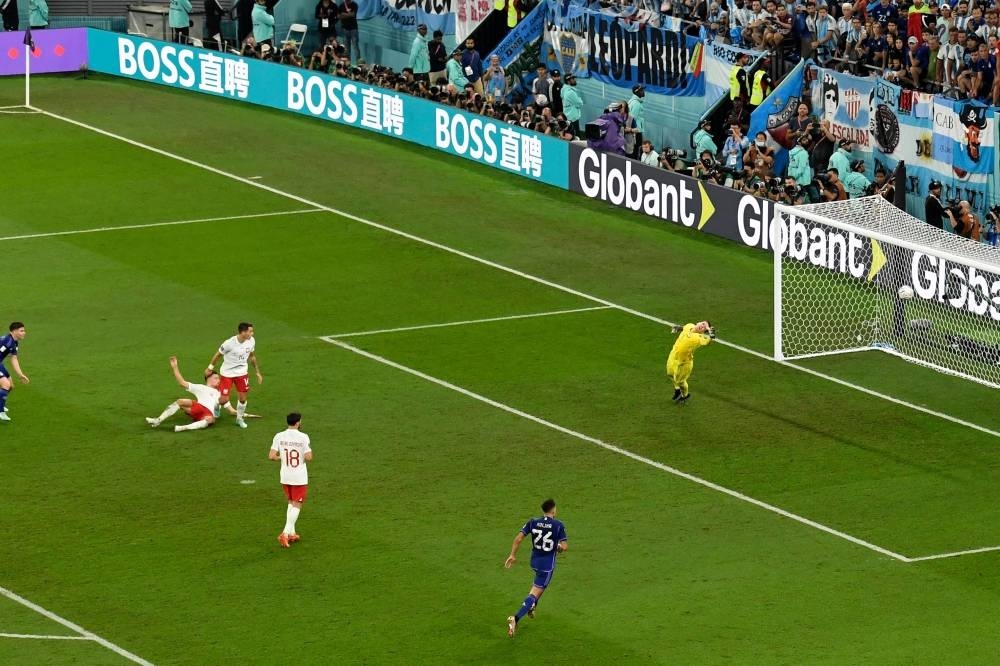 Argentina&#039;s forward #09 Julian Alvarez (L) scores his team&#039;s second goal during the Qatar 2022 World Cup Group C football match between Poland and Argentina at Stadium 974.