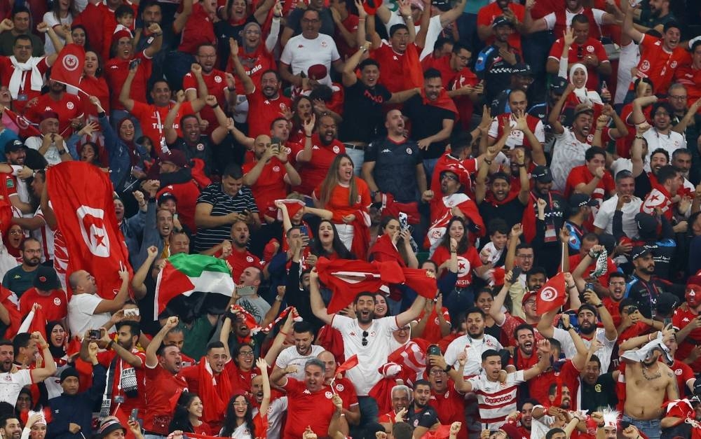 Tunisia fans celebrate their team's goal at Education City Stadium, Doha.