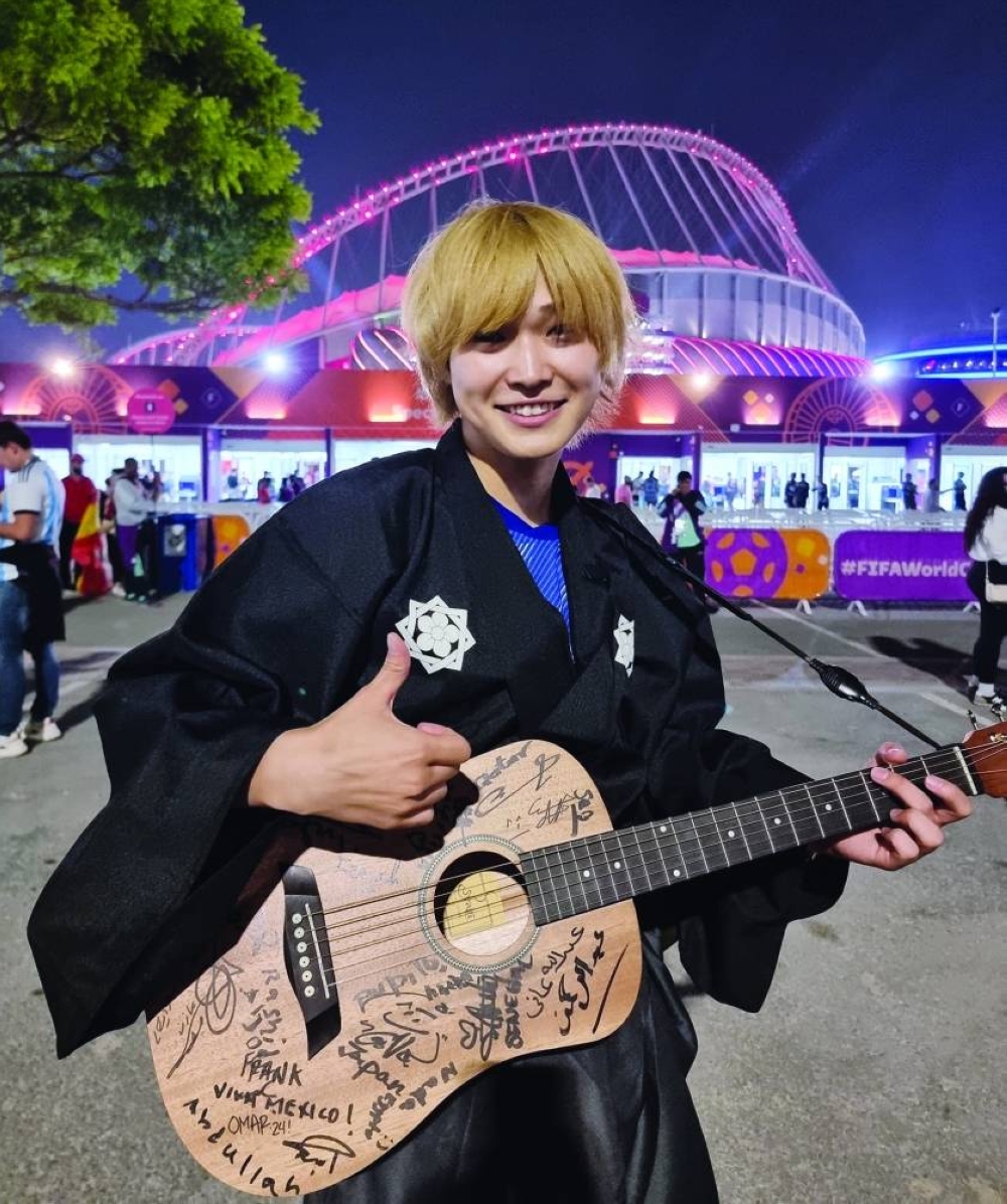 Japanese national Tomi, wearing a traditional dress, welcomes fans at the stadium's entrance. PICTURES: Joey Aguilar