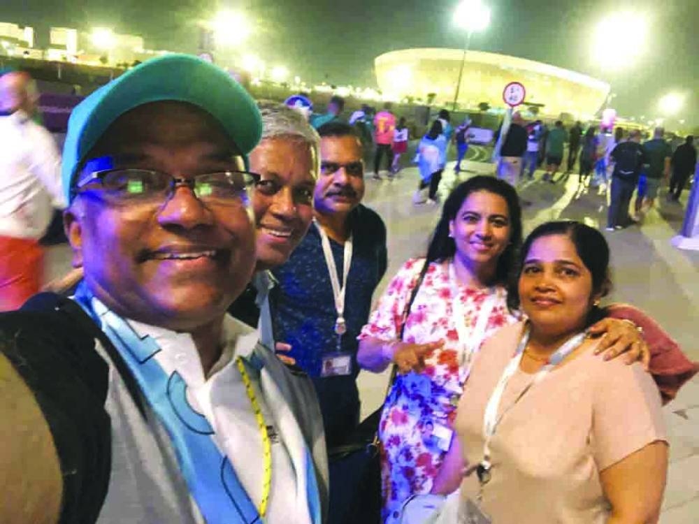 Biju John with some of his visiting friends in front of Lusial Stadium.