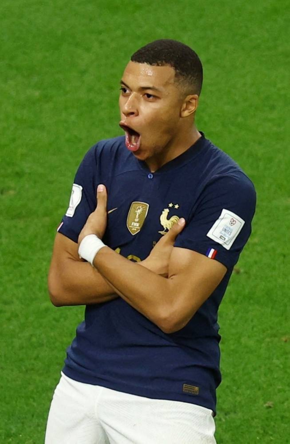France's Kylian Mbappe celebrates scoring France's third goal.