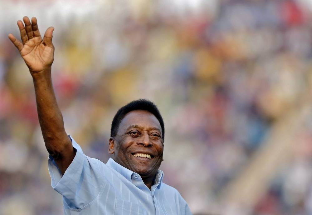 Legendary Brazilian soccer player Pele waves to the spectators before the start of under-17 boys' final soccer match of Subroto Cup tournament at Ambedkar stadium in New Delhi, India, October 16, 2015. AFP