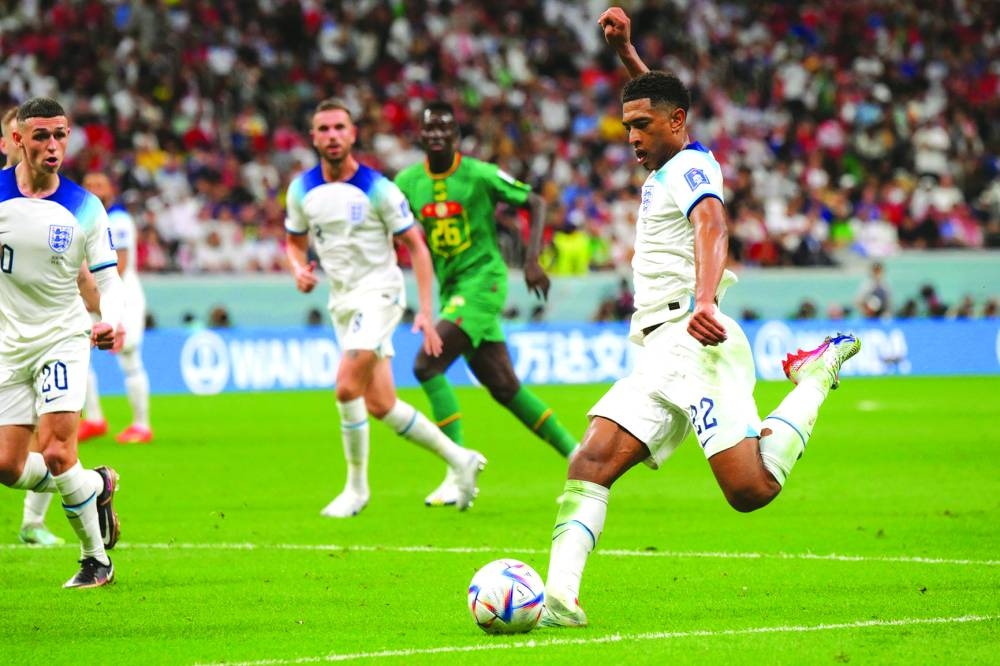 England’s midfielder Jude Bellingham strikes the ball during the Qatar 2022 World Cup round of 16 match against Senegal at the Al Bayt Stadium in Al Khor on Sunday. (AFP)