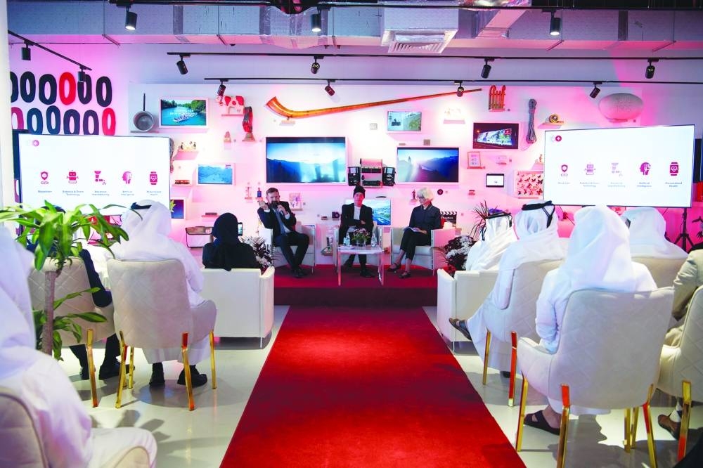Swiss ambassador Edgar Doerig speaks at the session as Swiss Pritzker Prize-winning architect Jacques Herzog and others look on.