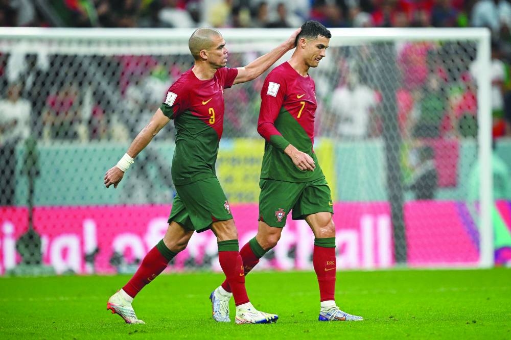 Portugal’s Pepe (left) with Cristiano Ronaldo during the Qatar 2022 Round of 16 match against Switzerland at Lusail Stadium yesterday. (AFP)