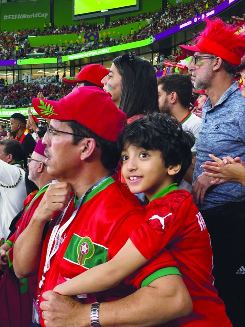 Raja's father and brother at the game