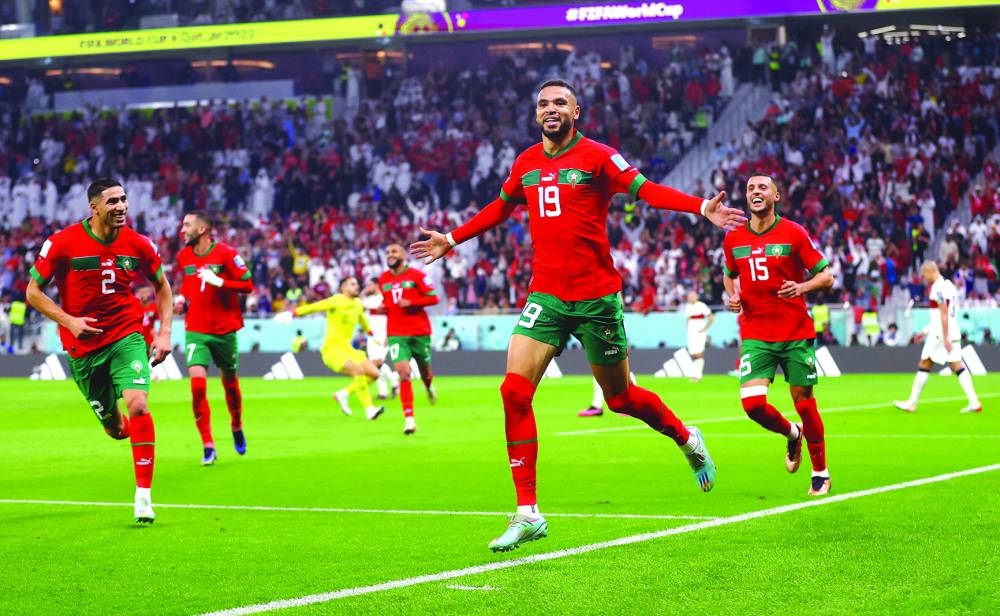 Morocco’s Youssef En-Nesyri celebrates after scoring against Portugal during the Qatar 2022 World Cup quarter-final at the Al Thumama Stadium in Doha yesterday. (Reuters)