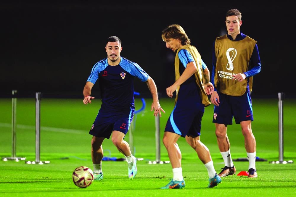 Croatia’s defender Josip Juranovic (left) takes part in a training session at the Al Erssal training site in Doha, yesterday, on the eve of the Qatar 2022 World Cup semi-final match against Argentina. (AFP)
