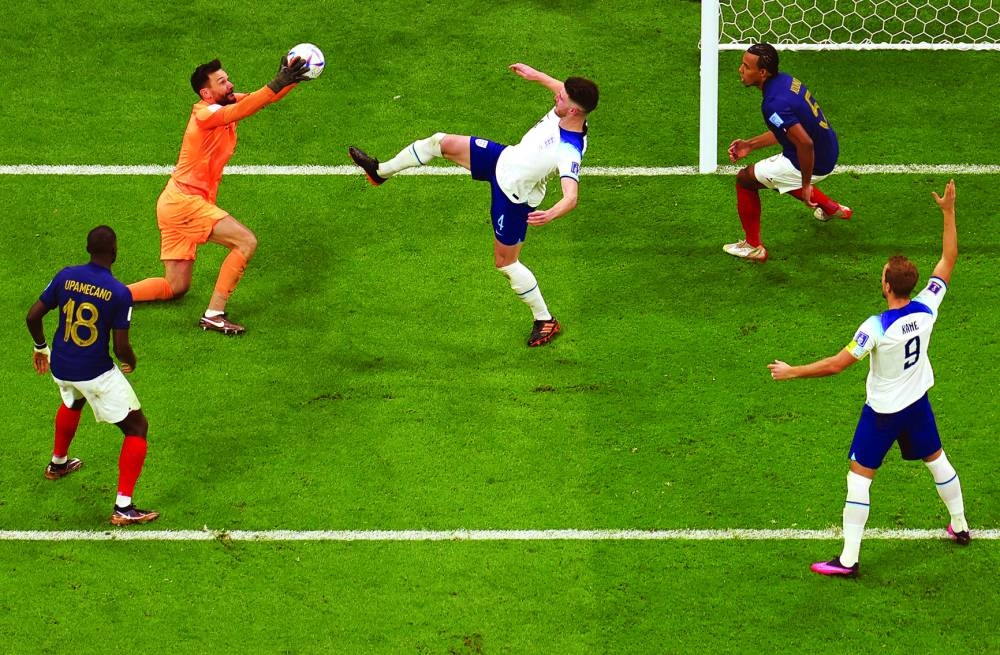 France’s goalkeeper Hugo Lloris (left) gathers the loose ball ahead of England’s midfielder Declan Rice (centre) during the Qatar 2022 World Cup quarter-final match at the Al Bayt Stadium in Al Khor, on Saturday. (AFP)