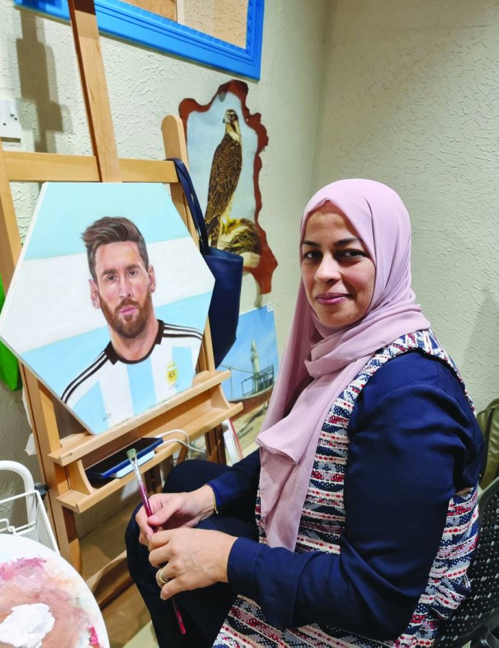 Wafa Elsebaie shows her portrait of football superstar Lionel Messi. PICTURES: Joey Aguilar