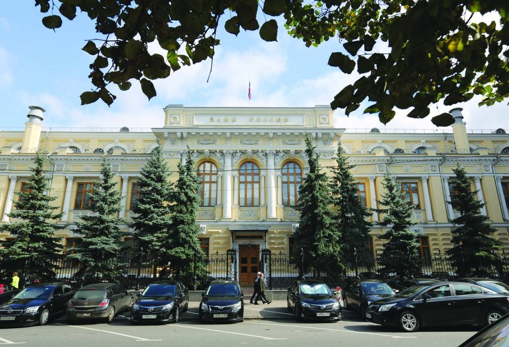 Pedestrians pass the entrance to the headquarters of Russia's central bank in Moscow. The Bank of Russia delivered its strongest warning yet that the Kremlin’s call-up of men to fight in Ukraine is leaving the economy deprived of workers and could put pressure on inflation, as it left interest rates unchanged for a second meeting.