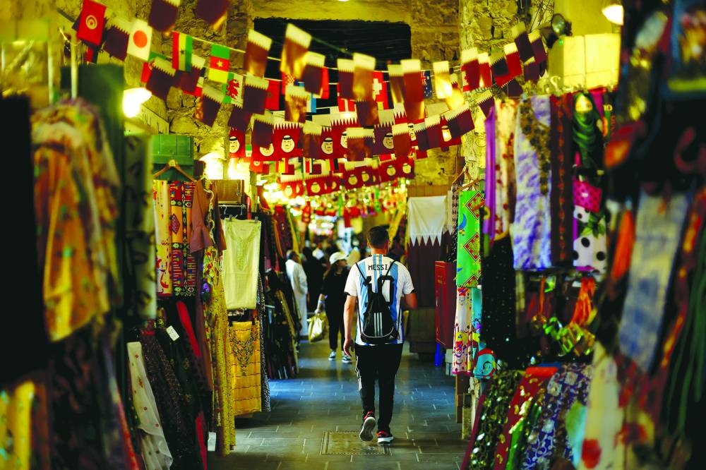 An Argentina fan with Lionel Messi’s name and number on the back of his shirt is seen at Souq Waqif market in Doha. (Reuters)