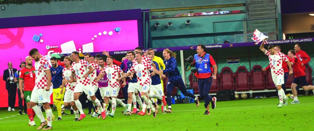 Croatian players celebrate their win over Morocco during the Qatar 2022 World Cup third place play-off at the yesterday.