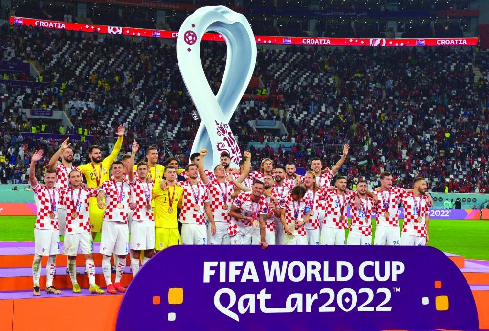 Croatia’s players celebrate with medals after winning the FIFA World Cup Qatar 2022 third place play-off match against Morocco at Khalifa International Stadium in Doha yesterday.  PICTURES: Shaji Kayamkulam