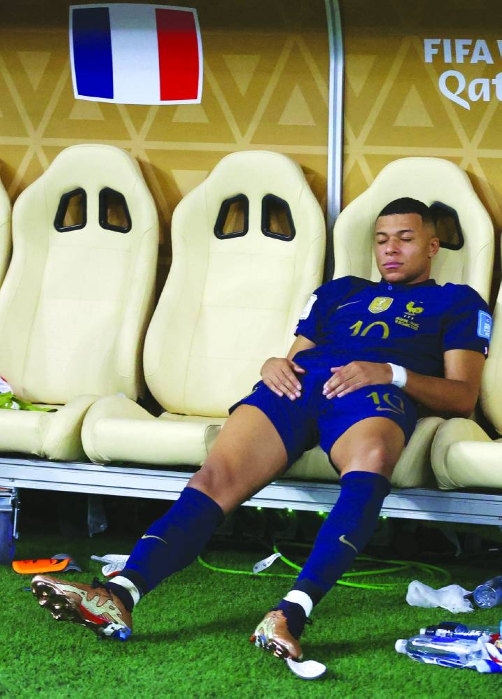Kylian Mbappe (also left) is dejected after France’s loss to Argentina in the FIFA World Cup Qatar 2022 final at the Lusail Stadium. (Reuters)