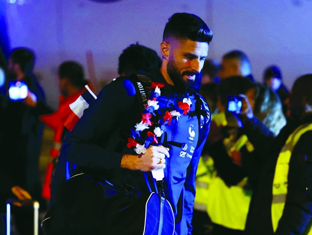 France’s Olivier Giroud arrives at Paris Charles de Gaulle Airport in Paris on Monday. (AFP)