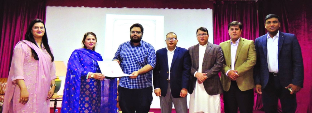 Dr Faisal Hanif being honoured on the occasion.