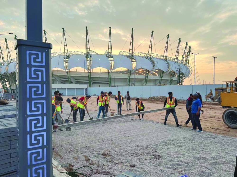 Workers at the Al Minaa Olympic Stadium in Basra.