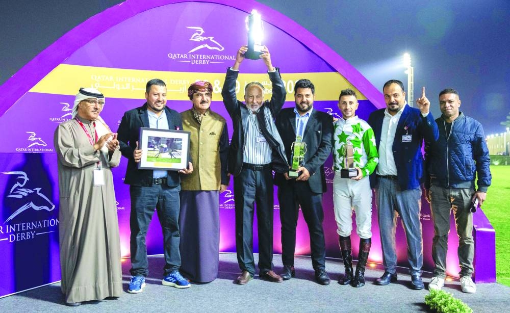 Director of Racing Department at the Qatar Racing and Equestrian Club Abdullah Rashid al-Kubaisi (left) with the connections of Al Warkah, which won the $75000 Local Thoroughbreds for three-year-old fillies only (Far Bend). 