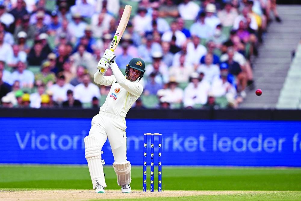 Australia’s Alex Carey drives a delivery away on the third day of the second Test against South Africa at the MCG in Melbourne yesterday. (AFP) 