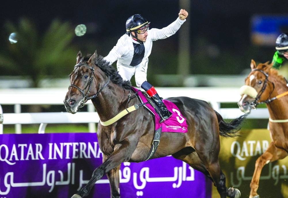 Marco Casamento celebrates after riding Emperor Maximus to victory in the feature event at the Qatar Derby yesterday.