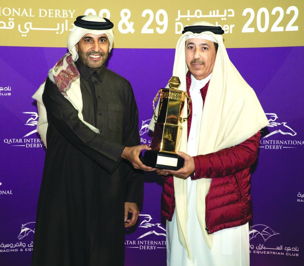 QREC Chairman Issa bin Mohamed al-Mohannadi presents a trophy to connection of Moshrif, which won the Qatar International Derby (Group PA) yesterday.