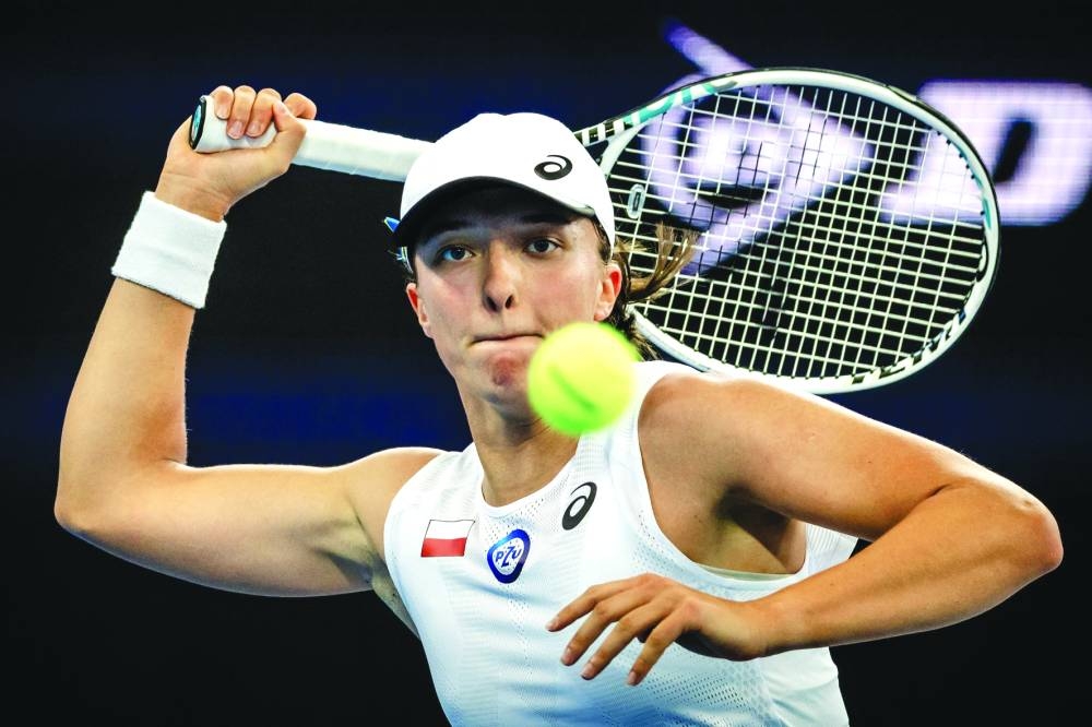 Poland’s Iga Swiatek hits a return to Kazakhstan’s Yulia Putintseva during their United Cup match in Brisbane yesterday. (AFP) 