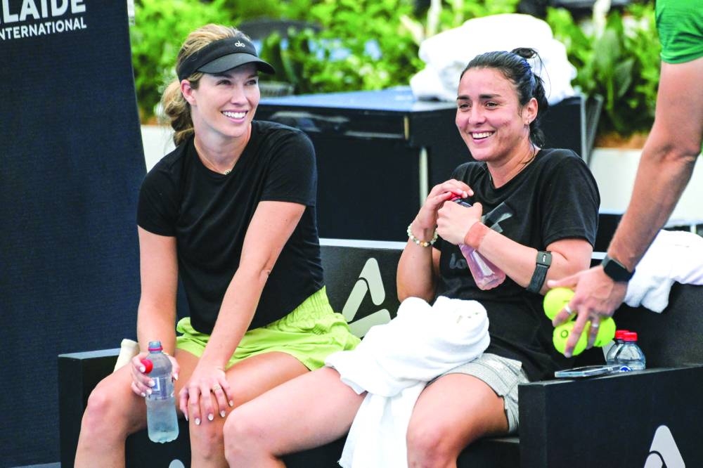 Tunisia’s Ons Jabeur (right) with Danielle Collins during a practice session ahead of the WTA Adelaide International tournament yesterday. (AFP)