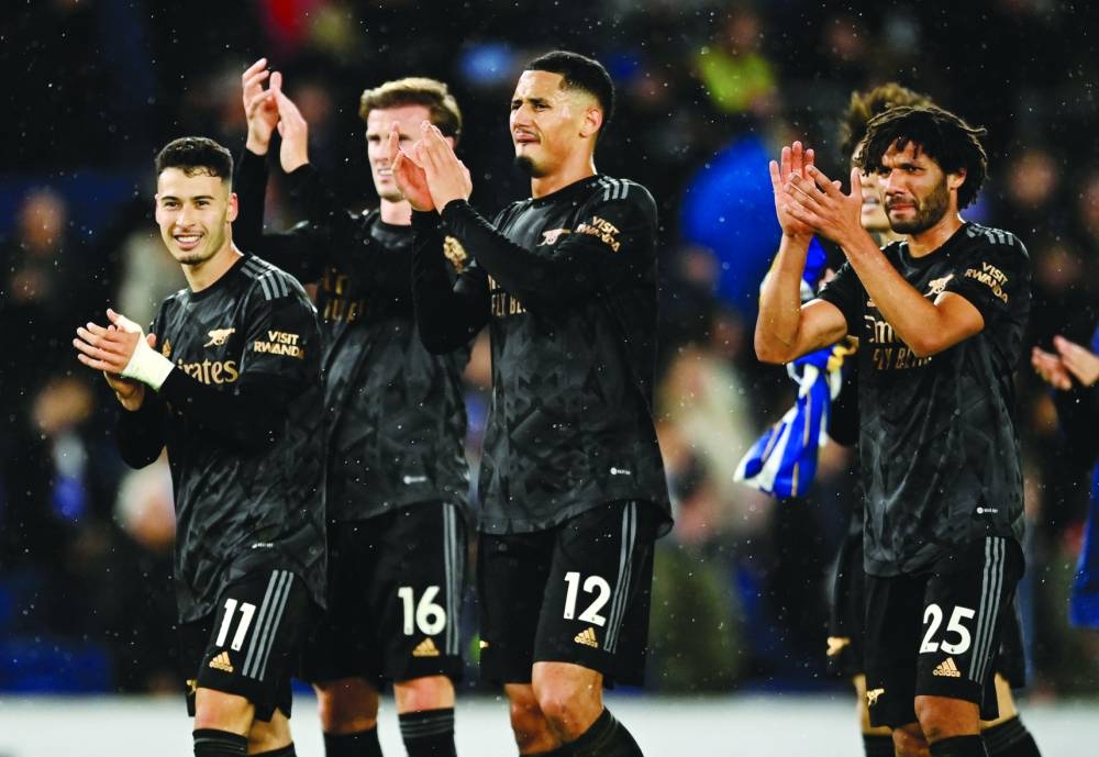 Arsenal’s Gabriel Martinelli, Rob Holding, William Saliba and Mohamed Elneny celebrate after their victory over Brighton & Hove Albion in Brighton yesterday. (Reuters)