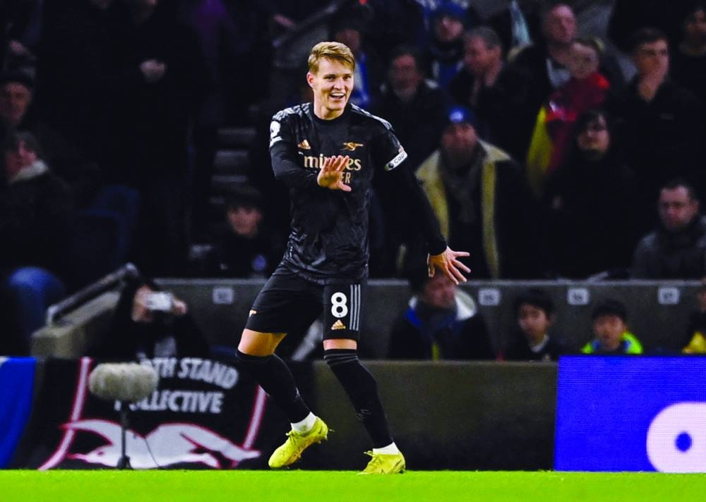Soccer Football - Premier League - Brighton & Hove Albion v Arsenal - The American Express Community Stadium, Brighton, Britain - December 31, 2022
Arsenal's Martin Odegaard celebrates scoring their second goal REUTERS/Tony Obrien EDITORIAL USE ONLY. No use with unauthorized audio, video, data, fixture lists, club/league logos or 'live' services. Online in-match use limited to 75 images, no video emulation. No use in betting, games or single club	/league/player publications.  Please contact your account representative for further details.