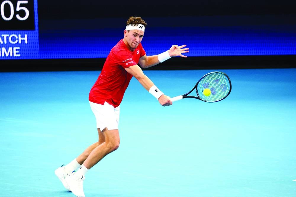 Norway’s Casper Ruud hits a return against Brazil’s Thiago Monteiro during their singles match of the United Cup at Pat Rafter Arena in Brisbane yesterday. (AFP)