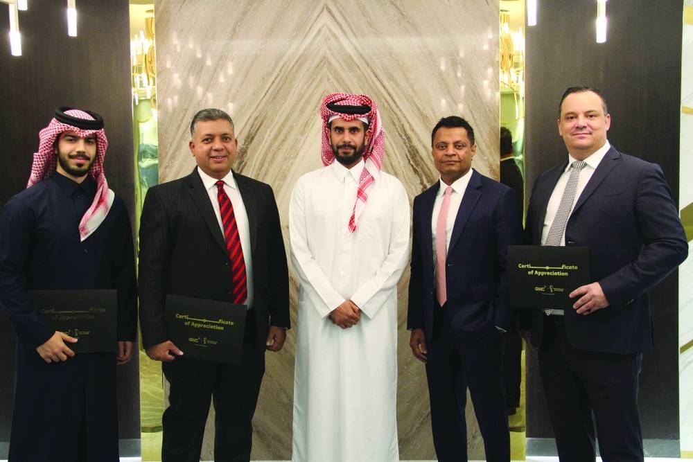 GWC chairman Sheikh Abdulla bin Fahad bin Jassim bin Jaber al-Thani and Group CEO Ranjeev Menon with members of the honoured teams.