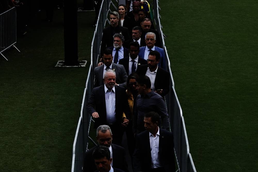 Brazil's President Luiz Inacio Lula da Silva (L), accompanied by his wife Rosangela "Janja" da Silva, attends the wake of the late Brazilian football legend Pele at the Urbano Caldeira stadium in Santos, Sao Paulo state, Brazil on January 3. AFP