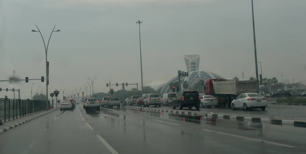 Rainy and cloudy conditions in Doha Tuesday. PICTURES: Shaji Kayamkulam and QNA