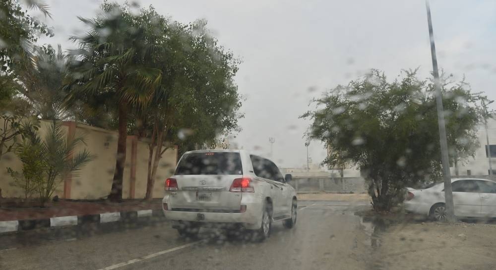 Rainy and cloudy conditions in Doha Tuesday. PICTURES: Shaji Kayamkulam and QNA