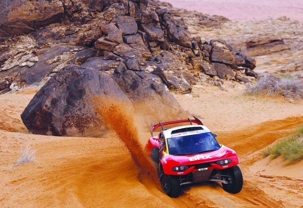 French driver Sebastien Loeb and Belgian co-driver Fabian Lurquin compete during the fourth stage of the Dakar Rally around Ha’il in Saudi Arabia yesterday. (AFP)