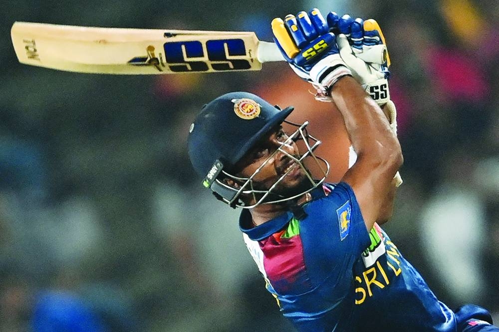 Sri Lanka’s captain Dasun Shanaka plays a shot during the second Twenty20 against India in Pune yesterday. (AFP)