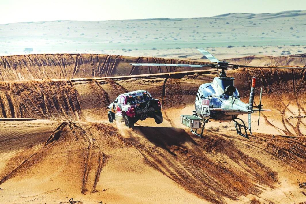 Toyota’s Qatari driver Nasser al-Attiyah and his French co-driver Mathieu Baumel compete during the sixth stage of the Dakar Rally between Ha’il and Al Duwadimi in Saudi Arabia yesterday.