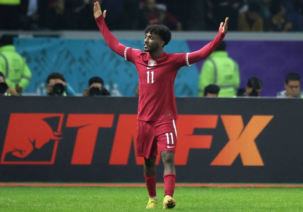Qatar's forward Amro Siraj celebrates after scoring his team's first goal during the Arabian Gulf Cup football match between Kuwait and Qatar at the Al-Minaa Olympic Stadium in Iraq's southern city of Basra on January 7. AFP