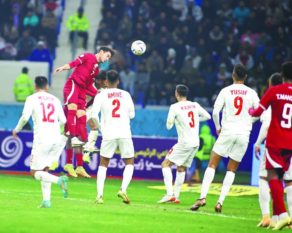 Qatar’s Ahmed Alaaeldin scores of a header during Arabian Gulf Cup Group B match against Bahrain at the Al Minaa Olympic Stadium in Basra, Iraq, yesterday.