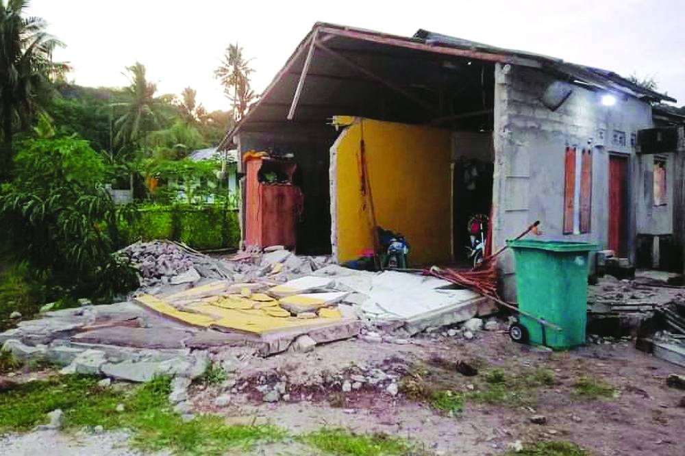 A damaged house after a 7.6-magnitude earthquake hit deep under the ocean off Indonesia and East Timor, in the Tanimbar islands in Maluku. 